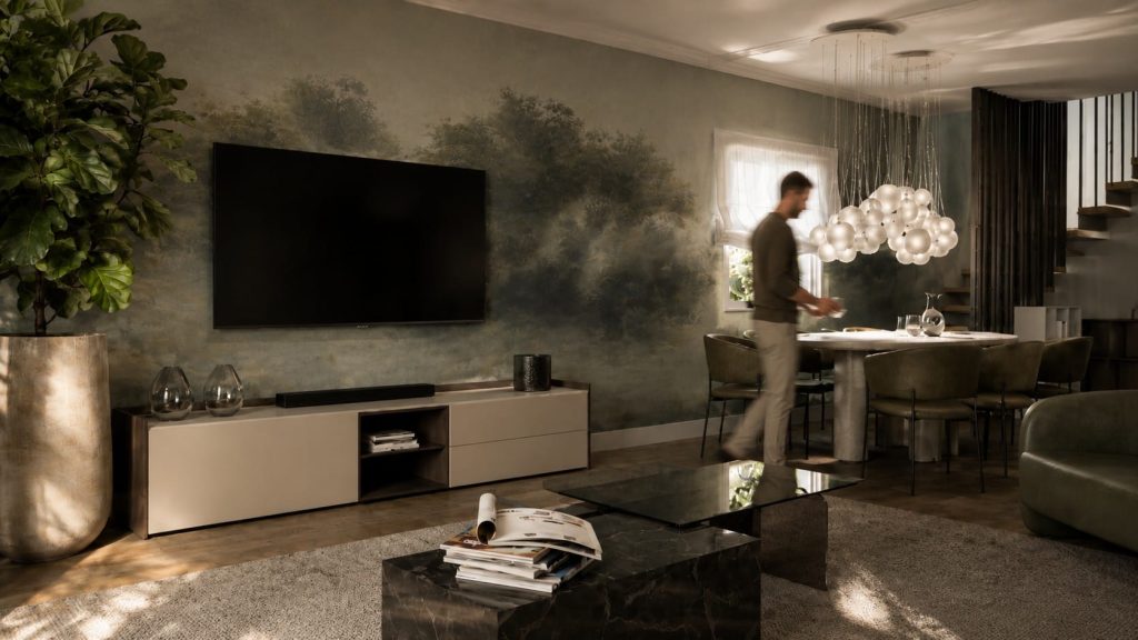 Vivienda en la sierra de Madrid (BTV36): salón con papel pintado de paisaje y mueble de televisión a medida